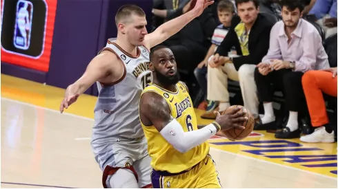 Los Angeles Lakers forward LeBron James gets past Denver Nuggets center<br />
Nikola Jokic