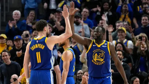 Draymond Green #23 of the Golden State Warriors celebrates with Klay Thompson #11 after scoring against the Dallas Mavericks late in the second half at Chase Center on April 02, 2024 in San Francisco, California.