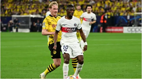 Ousmane Dembele of Paris Saint-Germain in a duel, action, with Julian Brandt of Borussia Dortmund