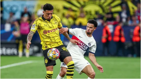 Jadon Sancho of Borussia Dortmund in duel against Zaire Emery of PSG