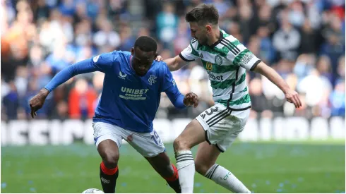 Abdallah Sima of Rangers vies with Greg Taylor of Celtic