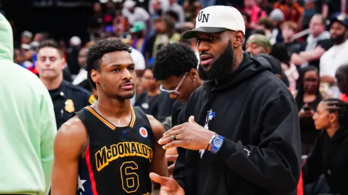 Bronny James #6 of the West team talks to LeBron James of the Los Angeles Lakers after the 2023 McDonald's High School Boys All-American Game at Toyota Center on March 28, 2023 in Houston, Texas.