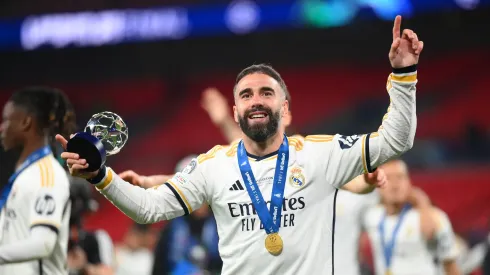 Daniel Carvajal of Real Madrid celebrates victory with his PlayStation Player of the Match award after Real Madrid defeat Borussia Dortmund during the UEFA Champions League 2023/24 Final match between Borussia Dortmund and Real Madrid CF at Wembley Stadium on June 01, 2024 in London, England.