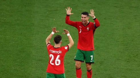 Cristiano Ronaldo of Portugal celebrates victory with teammate Francisco Conceicao after the UEFA EURO 2024 group stage match between Portugal and Czechia at Football Stadium Leipzig on June 18, 2024 in Leipzig, Germany.