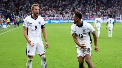 Harry Kane of England celebrates scoring his team's second goal with teammate Jude Bellingham during the UEFA EURO 2024 round of 16 match between England and Slovakia at Arena AufSchalke on June 30, 2024 in Gelsenkirchen, Germany.