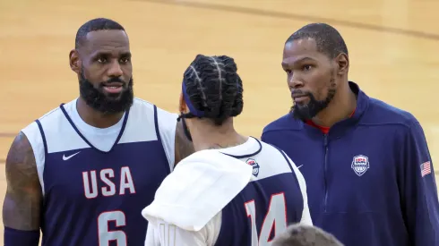 LeBron James #6, Anthony Davis #14 and Kevin Durant #7 of the 2024 USA Basketball Men's National Team talk during a practice session at the team's training camp at the Mendenhall Center at UNLV on July 07, 2024 in Las Vegas, Nevada.