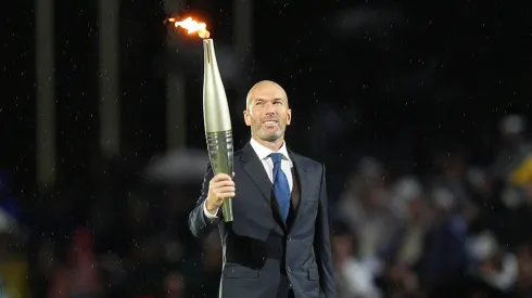 Zinedine Zidane holding the Olympics torchZinedine Zidane holding the Olympics torch