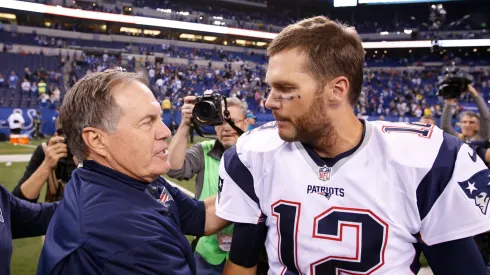 Bill Belichick and Tom Brady shake hands after a Patriots game.