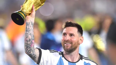 Lionel Messi of Argentina celebrates with the FIFA World Cup trophy