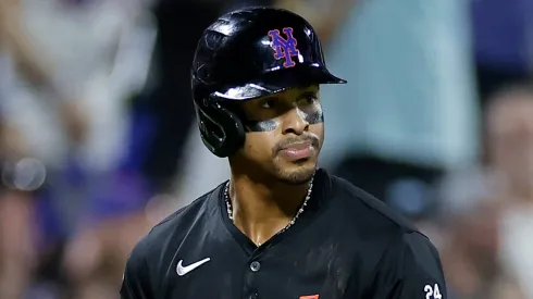 Francisco Lindor #12 of the New York Mets reacts as he watches a three-run home run by Brandon Nimmo #9 of the New York Mets during the fourth inning against the Miami Marlins at Citi Field.
