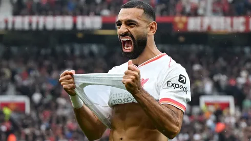 Mohamed Salah of Liverpool celebrates scoring his team's third goal during the Premier League match between Manchester United FC and Liverpool FC at Old Trafford on September 01, 2024 in Manchester, England.