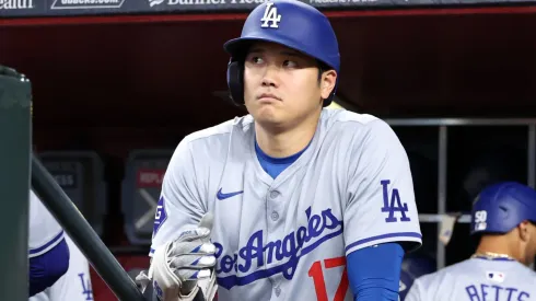 Shohei Ohtani #17 of the Los Angeles Dodgers stands on the dugout stairs before the first inning against the Arizona Diamondbacks at Chase Field.