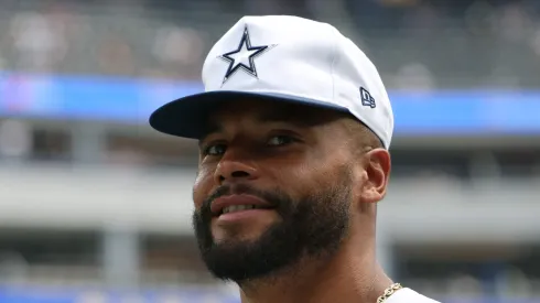 Dak Prescott #4 of the Dallas Cowboys smiles before a preseason game against the Los Angeles Rams at SoFi Stadium on August 11, 2024 in Inglewood, California.