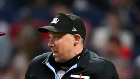Home plate umpire Adam Hamari during the Guardians-Rangers ninth inning at Progressive Field on August 23, 2024 in Cleveland, Ohio.