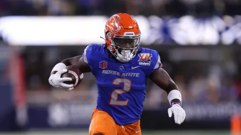 Boise State running back ASHTON JEANTY (2) runs with the ball while being tackled by UCLA linebacker DARIUS MUASAU (53) during the 2023 Starco Brands LA Bowl Hosted by Gronk between UCLA and Boise State at SoFi Stadium in Los Angeles, California.