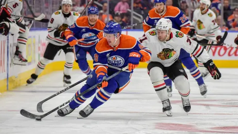 Ty Emberson #49 of the Edmonton Oilers skates against Taylor Hall #71 of the Chicago Blackhawks during the first period of the game at Rogers Place on October 12, 2024, in Edmonton, Alberta, Canada. (Photo by Leila Devlin/Getty Images)