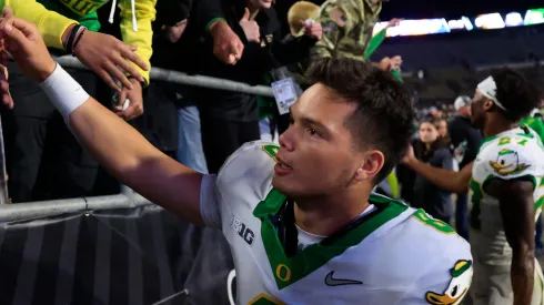 Dillon Gabriel #8 of the Oregon Ducks interacts with fans after the game against the Purdue Boilermakers at Ross-Ade Stadium on October 18, 2024 in West Lafayette, Indiana.