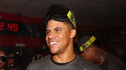 Juan Soto #22 of the New York Yankees celebrates in the locker room after beating the Cleveland Guardians 5-2 in 10 innings in Game Five of the American League Championship Series at Progressive Field on October 19, 2024 in Cleveland, Ohio.