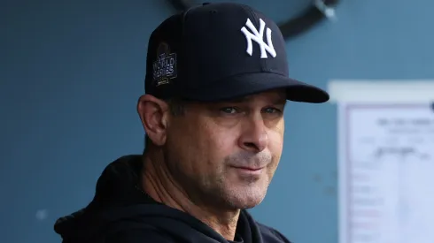 Manager Aaron Boone #17 of the New York Yankees looks on from the dugout before playing the Los Angeles Dodgers during Game Two of the 2024 World Series at Dodger Stadium on October 26, 2024 in Los Angeles, California.