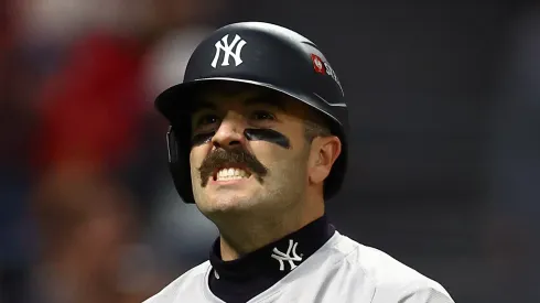 Austin Wells #28 of the New York Yankees reacts after a strikeout in the fifth inning against the Cleveland Guardians during Game Four of the American League Championship Series at Progressive Field on October 18, 2024 in Cleveland, Ohio.