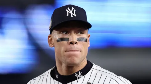 Aaron Judge #99 of the New York Yankees jogs in at the end of the inning after catching a ball hit off the bat of Freddie Freeman #5 of the Los Angeles Dodgers at the wall during the fourth inning of Game Five of the 2024 World Series at Yankee Stadium on October 30, 2024 in the Bronx borough of New York City.