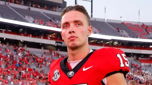 Carson Beck #15 of the Georgia Bulldogs leaves the field following the game against the Auburn Tigers at Sanford Stadium on October 5, 2024 in Athens, Georgia.