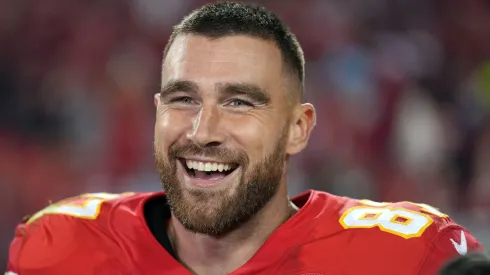 Travis Kelce #87 of the Kansas City Chiefs smiles while being interviewed after the Chiefs defeated the Las Vegas Raiders 30-29 to win the game at Arrowhead Stadium on October 10, 2022.