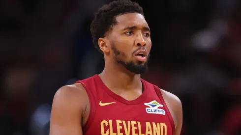 Donovan Mitchell #45 and Darius Garland #10 of the Cleveland Cavaliers confer against the Chicago Bulls during the second half of a preseason game at the United Center on October 18, 2024 in Chicago, Illinois.