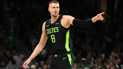 Kristaps Porzingis #8 of the Boston Celtics reacts after making a three-point basket against the LA Clippers during the first quarter at the TD Garden on November 25, 2024 in Boston, Massachusetts.