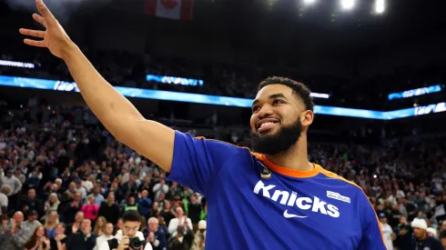 Karl-Anthony Towns #32 of the New York Knicks acknowledges the fans prior to the start of the game against the Minnesota Timberwolves at Target Center on December 19, 2024 in Minneapolis, Minnesota.