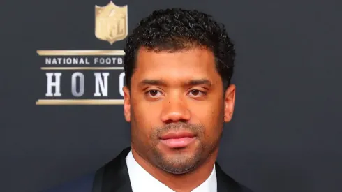 Russell Wilson posing for a picture.
