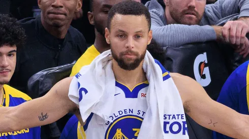 Stephen Curry 30 of the Golden State Warriors reacts to plays from the sidelines during their regular season NBA matchup against the Los Angeles Clippers.