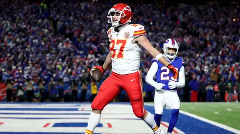 Travis Kelce #87 of the Kansas City Chiefs celebrates after scoring a 22 yard touchdown against the Buffalo Bills during the second quarter in the AFC Divisional Playoff game at Highmark Stadium on January 21, 2024 in Orchard Park, New York.