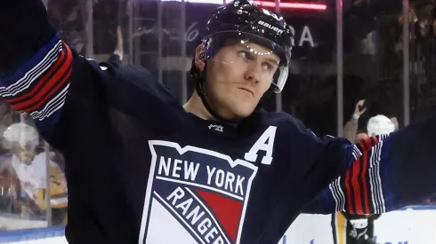 Adam Fox #23 of the New York Rangers celebrates a goal by Artemi Panarin #10 against Alex Nedeljkovic #39 of the Pittsburgh Penguins at 7:28 of the second period at Madison Square Garden on December 06, 2024 in New York City.