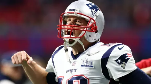 Tom Brady #12 of the New England Patriots pumps his fist running onto the field before Super Bowl LIII against the Los Angeles Rams at Mercedes-Benz Stadium on February 03, 2019 in Atlanta, Georgia.