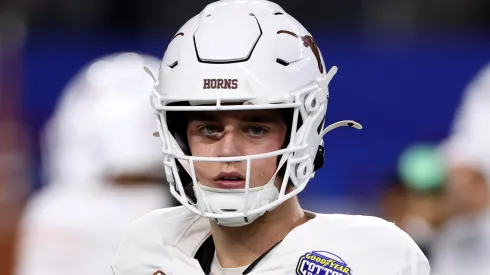 Arch Manning #16 of the Texas Longhorns warms up before the Goodyear Cotton Bowl against the Ohio State Buckeyes at AT&T Stadium on January 10, 2025 in Arlington, Texas.