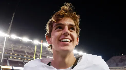 Arch Manning #16 of the Texas Longhorns celebrates after the game against the Texas A&M Aggies at Kyle Field on November 30, 2024 in College Station, Texas.
