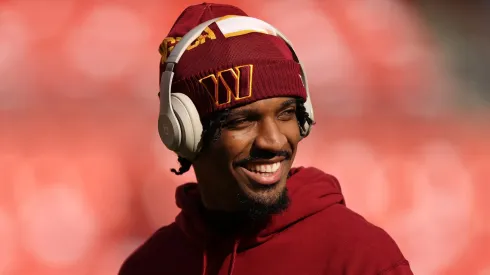 Jayden Daniels #5 of the Washington Commanders looks on prior to a game against the Tennessee Titans at Northwest Stadium on December 01, 2024 in Landover, Maryland.