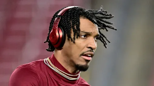 Jayden Daniels #5 of the Washington Commanders warms up prior to the NFC Wild Card Playoff against the Tampa Bay Buccaneers at Raymond James Stadium on January 12, 2025 in Tampa, Florida.