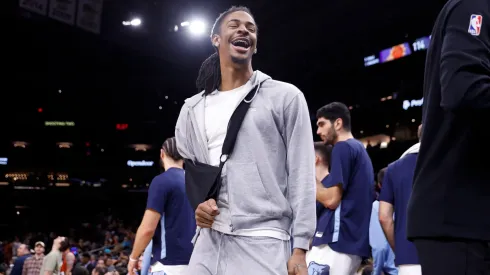 Ja Morant #12 of the Memphis Grizzlies reacts after Devin Booker #1 of the Phoenix Suns missed a free throw during the second half at Footprint Center on January 07, 2024 in Phoenix, Arizona.