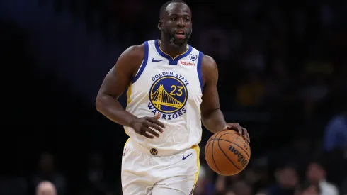 Draymond Green #23 of the Golden State Warriors dribbles the ball against the Washington Wizards during the first half at Capital One Arena.