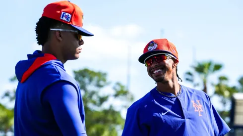 Juan Soto #22 and Francisco Lindor #12 of the New York Mets look on during spring training workouts at Clover Park on February 17, 2025 in Port St. Lucie, Florida.