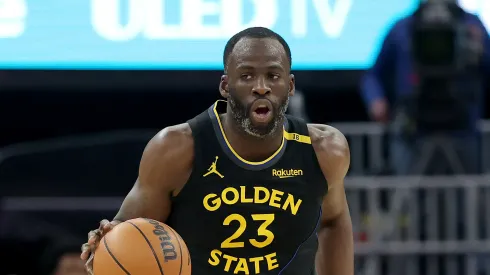 Draymond Green #23 of the Golden State Warriors dribbles the ball against the Charlotte Hornets at Chase Center