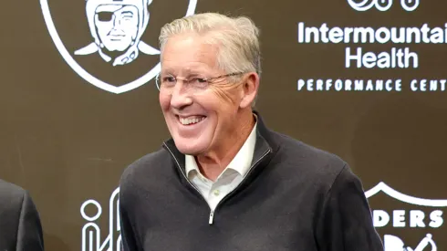 Owner and managing general partner Mark Davis (C) of the Las Vegas Raiders poses for photos with John Spytek (L) and Pete Carroll (R) during a news conference introducing Spytek as the general manager and Carroll as the head coach of the Raiders at the Las Vegas Raiders Headquarters/Intermountain Healthcare Performance Center on January 27, 2025 in Henderson, Nevada.