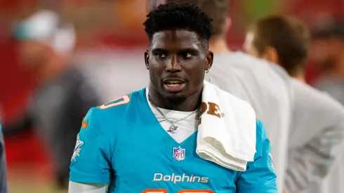 Tyreek Hill #10 of the Miami Dolphins looks on during a preseason game against the Tampa Bay Buccaneers at Raymond James Stadium on August 23, 2024.