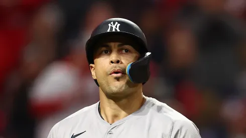 Giancarlo Stanton #27 of the New York Yankees reacts after a strikeout in the fourth inning against the Cleveland Guardians during Game Four of the American League Championship Series at Progressive Field on October 18, 2024 in Cleveland, Ohio.