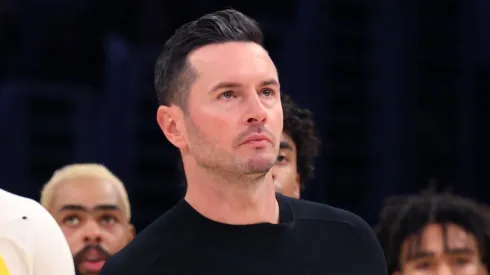 Bronny James #9 of the Los Angeles Lakers reacts with head coach JJ Redick during the second quarter against the Minnesota Timberwolves at Crypto.com Arena on October 22, 2024 in Los Angeles, California.