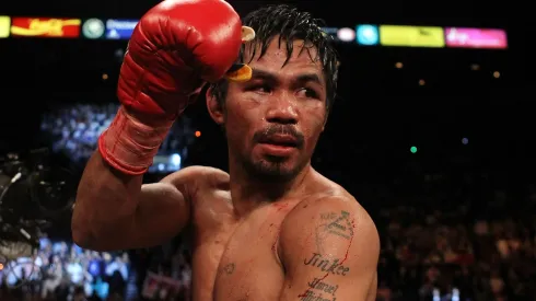 Manny Pacquiao celebrates his 12 round TKO victory against Miguel Cotto during their WBO welterweight title fight at the MGM Grand Garden Arena on November 14, 2009.