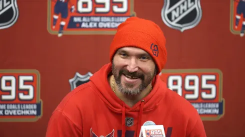 Alex Ovechkin #8 of the Washington Capitals answers questions following his record-setting 895th career goal during the second period against the New York Islanders at UBS Arena on April 06, 2025 in Elmont, New York. Ovechkin's goal passes Wayne Gretzky's 894 goals to become the NHL all-time goal-scoring leader.