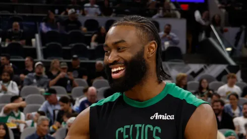Chris Paul #3 of the San Antonio Spurs greets Jaylen Brown #7 of the Boston Celtics before the start of their game